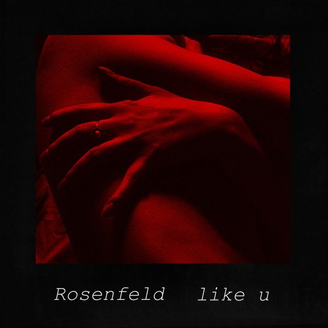 Pochette de Like U : une main sur une peau nue, dans une lumière rouge